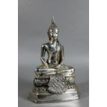 A 20th century silvered base-metal Thai figure of Shakyamuni Buddha with hands in the meditation