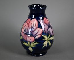 A Walter Moorcroft 'Anenome' blue-ground vase, 19 cm high