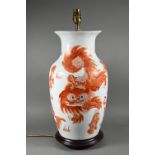 A Chinese red and white baluster vase (mounted as a lamp on hardwood stand) painted in iron red