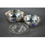 A graduated pair of Belgian .900 grade planished bowls in the Arts & Crafts manner, each applied