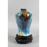 A Chinese Junyao style meiping vase, the exterior covered in a thick striated opaque blue glaze with
