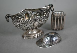 A Victorian silver stemmed oval salt, richly embossed and chased with scrolling foliage, Chester