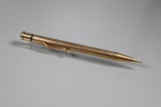 A 9ct yellow gold cased propelling 'Yard-O-led' pencil, engine turned decoration