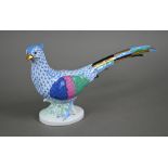 A Herend (Hungary) porcelain pheasant, painted with blue scale, 17 x 32 cm