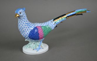 A Herend (Hungary) porcelain pheasant, painted with blue scale, 17 x 32 cm