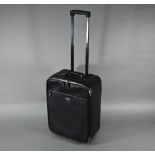 A Prada carry-on suitcase, with wheels and trolley-handle, nylon and Saffiano leather exterior,