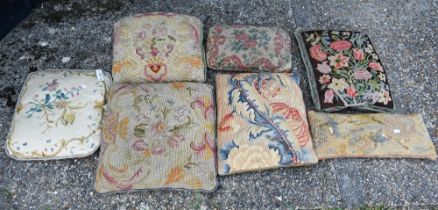 A stack of seven assorted antique tapestry cushions (7)