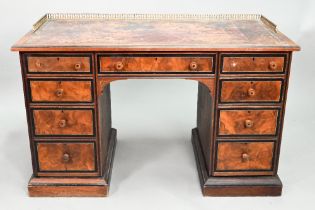 A Victorian Aesthetic period ebonised and walnut pedestal desk, the tooled leather inset top with