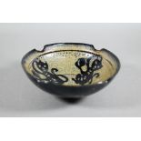 A Chinese Southern Song style Jizhou stoneware bowl, the interior with three paper-cut monkeys