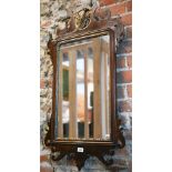 A Georgian style mahogany and gilt framed fret cut mirror, surmounted by a ho-ho bird, 91 cm x 50 cm