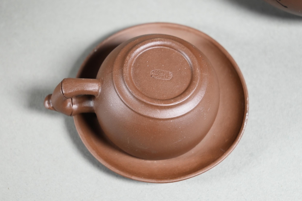 A boxed Chinese Yixing pottery tea set comprising a compressed globular teapot and cover with - Image 3 of 7