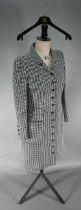 A Chanel Boutique coat dress in black and white houndstooth check wool, with high collar and small
