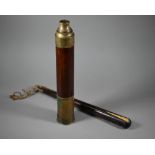 A Victorian brass and mahogany two-draw telescope, 88 cm overall to/w a rosewood belaying-pin with