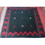 A North East Persian Sofreh kelim, navy ground with red decoration, 134 x 133 cm