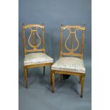 A pair of 19th century Empire giltwood side/music chairs with lyre-back splats (2)