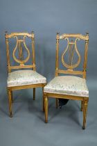 A pair of 19th century Empire giltwood side/music chairs with lyre-back splats (2)