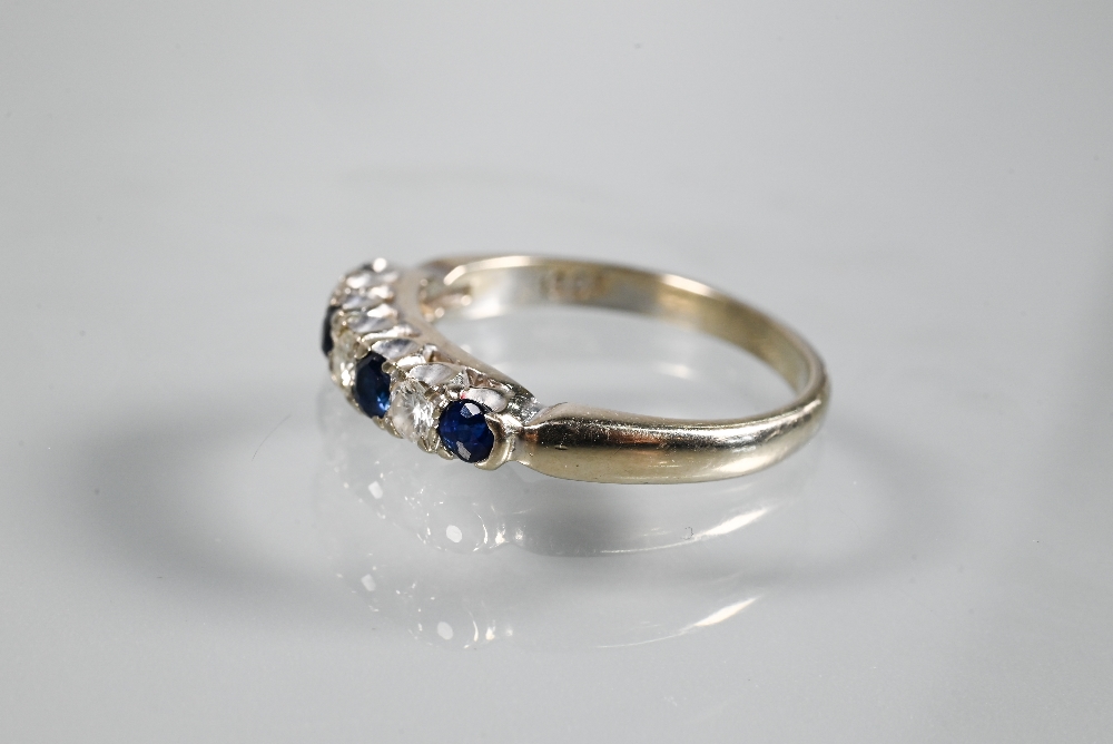 A seven stone ring, the alternate circular dark blue sapphires and diamonds in white metal setting - Image 3 of 3