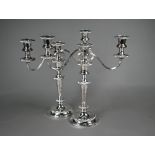 A pair of Barker-Ellis (Birmingham) epns three-sconce candelabra with baluster stems and gadrooned