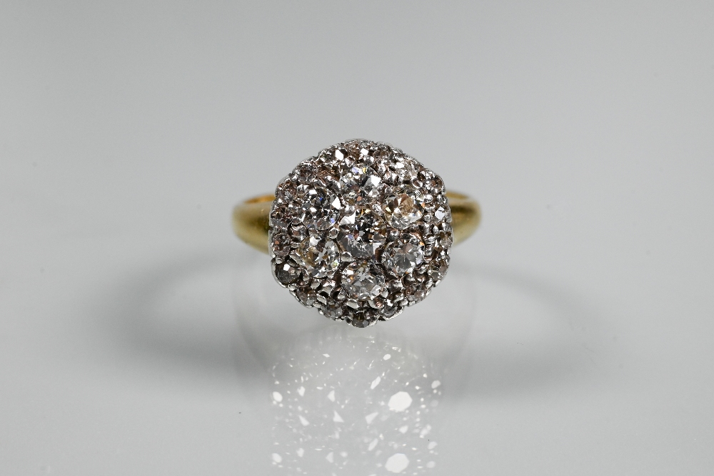 A diamond cluster ring, the central daisy cluster with border around, 18ct yellow and white gold