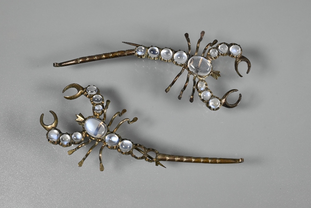 A pair of brooches in the form of moonstone-set scorpions, each with graduated cabochon moonstones