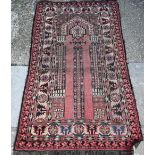 An antique Caucasian Red ground prayer rug, the geometric deign on crimson ground, 166 cm x 95 cm