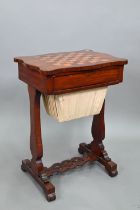 A Victorian satinwood work table, the chequerboard top over a frieze drawer and pleated silt storage