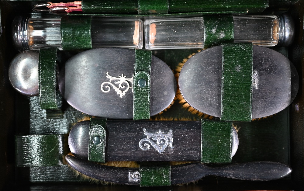 A leather toiletry case, the green Morocco interior fitted with ebony brushes with unmarked silver - Image 2 of 3