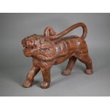 A mid-century hand carved weathered Asiatic lion, 50 cm long, 14 cm wide, 36 cm high