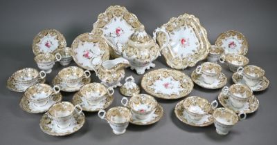 A Victorian china tea service, painted with roses within a beige and gilt border, comprising a