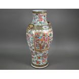 A large 19th Century Cantonese porcelain baluster vase, decorated in the famille rose palette with
