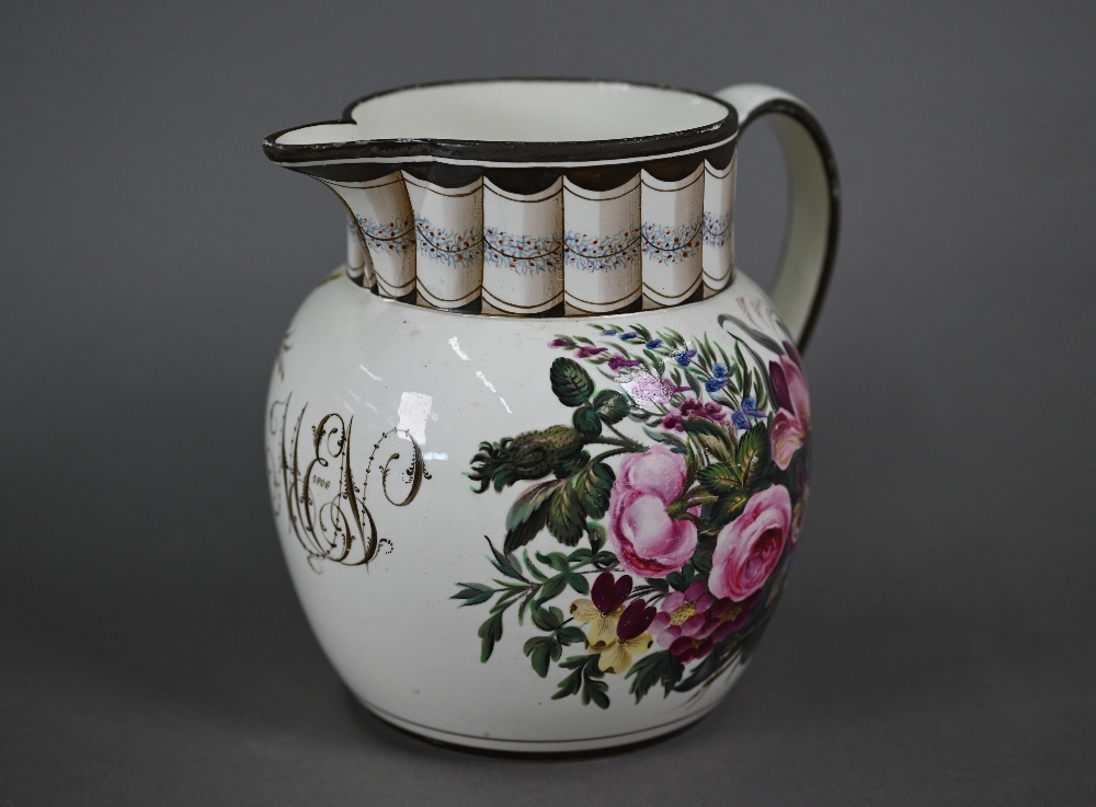 A Regency creamware jug with trompe l'oeuil pleated neck above 'MEN' monogram dated 1808, flanked by