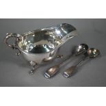 An Edwardian silver sauce boat with scroll handle and hoof feet, Birmingham 1909, to/w a Victorian