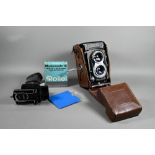A Rolleiflex twin-lens reflex camera with Synchro-Compur lens, in leather case with trigger-