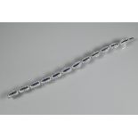 An 18ct white gold Art Deco style sapphire and diamond set bracelet formed of oval links with five