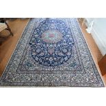 A central Persian part silk Nain carpet, the field centred by a medallion with flowering vines, on