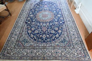 A central Persian part silk Nain carpet, the field centred by a medallion with flowering vines, on