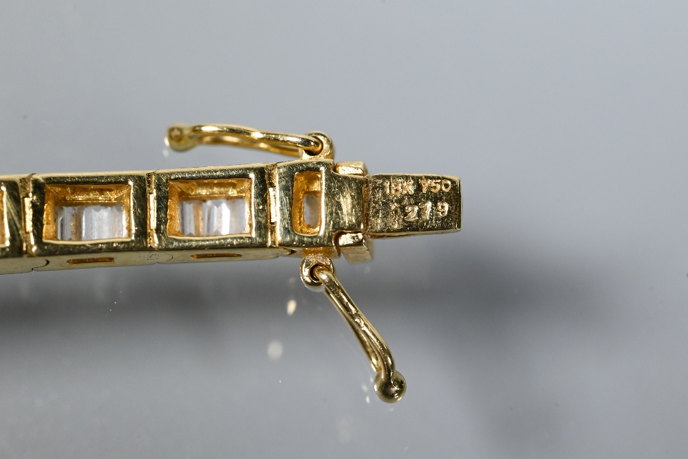 A modern diamond bracelet, the baguette-cut diamonds channel set in 18ct yellow gold, with concealed - Image 5 of 5