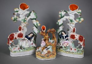 A pair of Victorian Staffordshire pottery spill-vase groups, dog protecting sleeping children from a