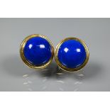 Pair of ear-clips set round half-domed lapis lazuli approx 1.5 cm diam, set yellow metal stamped