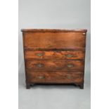 An 18th century and later composed oak and elm chest, the hinged top over three long graduated