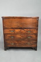 An 18th century and later composed oak and elm chest, the hinged top over three long graduated