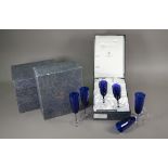 Six boxed pairs of St Louis glass blue flash and star-cut champagne flutes (boxes a/f)