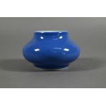 A Chinese monochrome powder blue brush washer/water pot of compressed globular form, blue glaze with