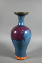 A Chinese Jun Yao style baluster vase evenly covered with a crackled turquoise glaze with large
