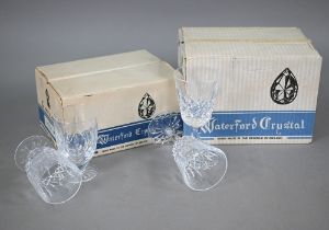 A boxed set of six Waterford 'Lismore' white wine glasses and six juice glasses (2 boxes)