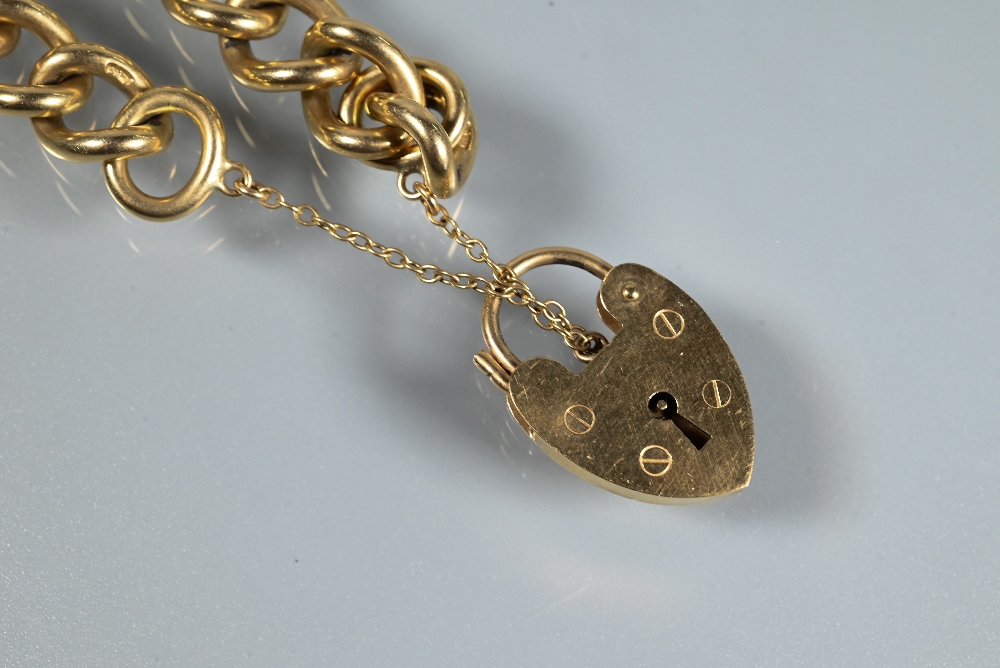 A 9ct yellow gold curb bracelet with padlock and safety chain attached, approx 42.7g - Image 2 of 4