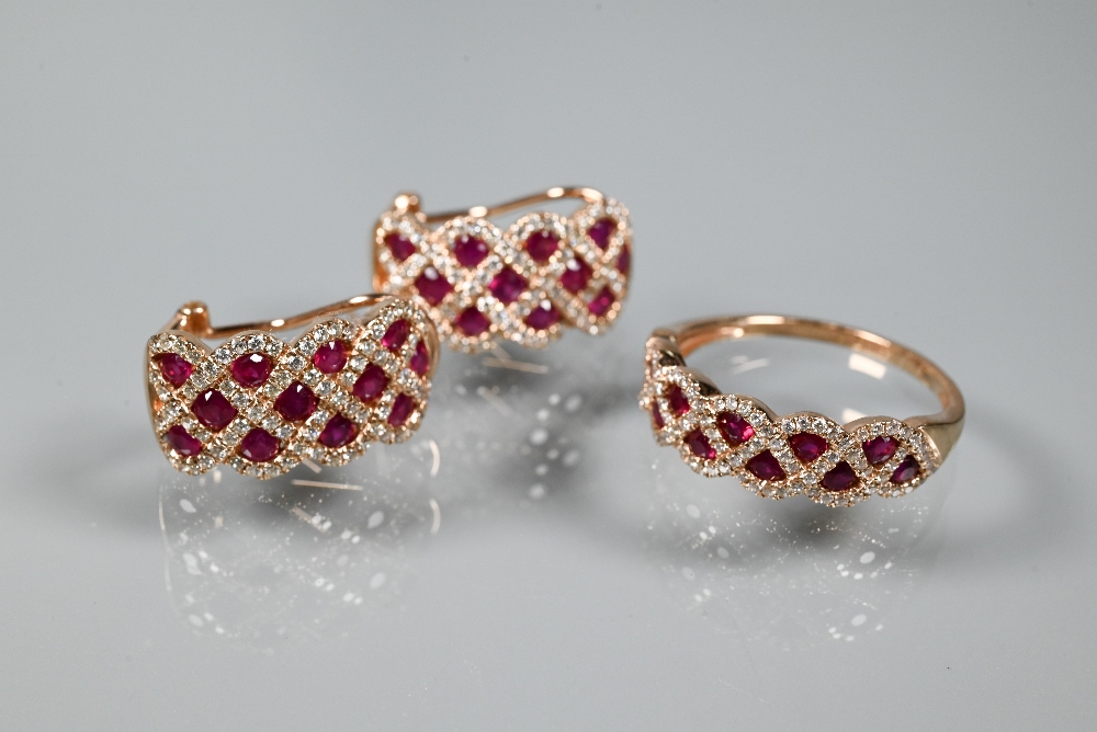 A ring and earring suite stamped 'Royal', with ruby and diamond lattice-work design, rose metal