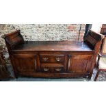 An 18th century oak low dresser / sideboard, of unusual form, the top with raised gallery ends