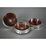 A pair of silver wine coasters, the turned bases inset with silver buttons, David R. Mills, London