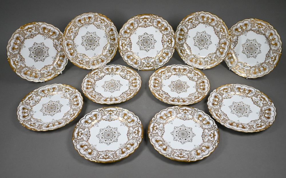 A set of eleven Edwardian Coalport china 22.5 cm plates, finely gilded with cornucopiae, scrolls,